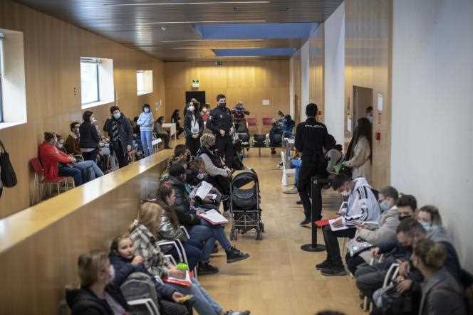 Ukrainian refugees wait at the refugee reception center to apply for asylum, in Pozuelo de Alarcón, near Madrid, on April 8, 2022.