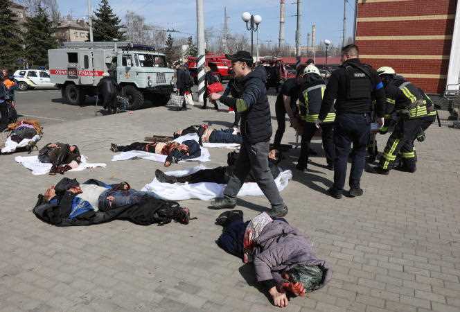 Rescue workers take care of the injured lying on the platform of the Kramatorsk railway station in Donbass (Ukraine) on April 8, 2022.