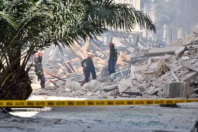 Rescuers search for possible victims in the rubble at the foot of the Saratoga hotel, in Havana, Friday, May 6, 2022.