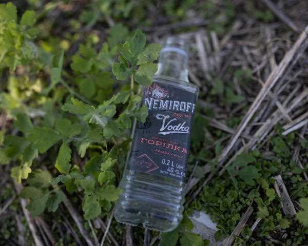 In the places that were occupied by the Russians, bottles of alcohol still litter the ground.  In a village northeast of kyiv, May 2, 2022.