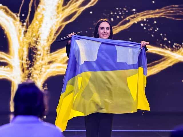 Jamala with a Ukraine flag.