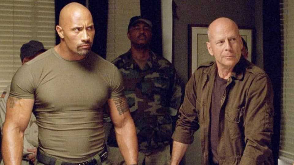 Movie scene: Two strong bald men.