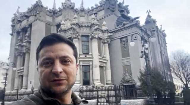 In this photo provided by the Press Office of the President of Ukraine, Volodymyr Zelensky speaks to the nation on his smartphone in central Kyiv, February 26, 2022.