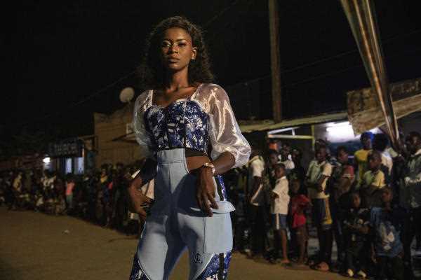 A model wears a dress by Austin designer Loïc Ayih-Yenu during Ouaga Fashion Week in Ouagadougou, Burkina Faso, Saturday, May 14, 2022.