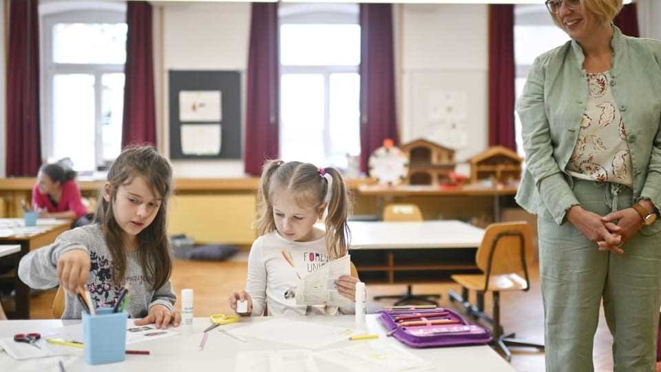 Two girls at a desk in school