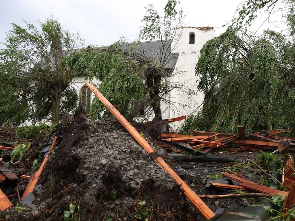 Fallen trees and destroyed church tower
