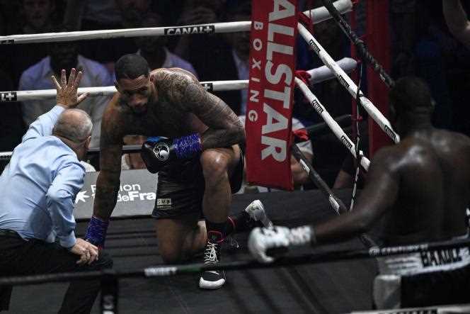 French boxer Tony Yoka (center) took a knee at the end of the first round of his fight against Congolese Martin Bakole at the AccorHotels Arena in Paris on May 14. 