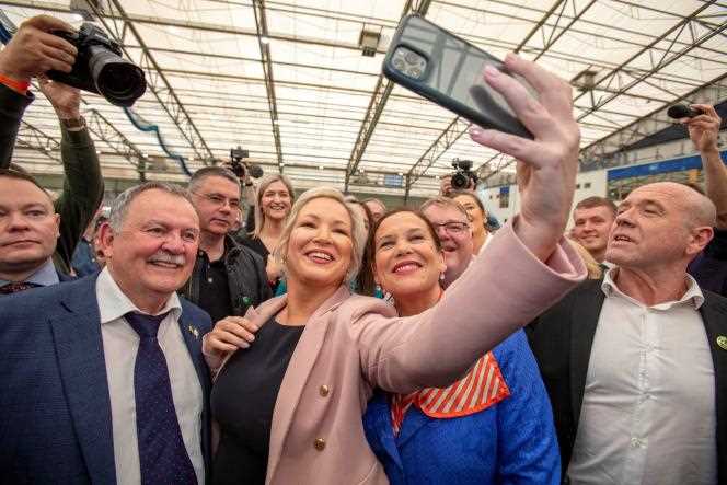 Sinn Fein's Northern Irish leader Michelle O'Neill poses for a photo with Nationalist party chairwoman Mary Lou McDonald on May 7, 2022 as their political party cruises to a historic victory in the British province.