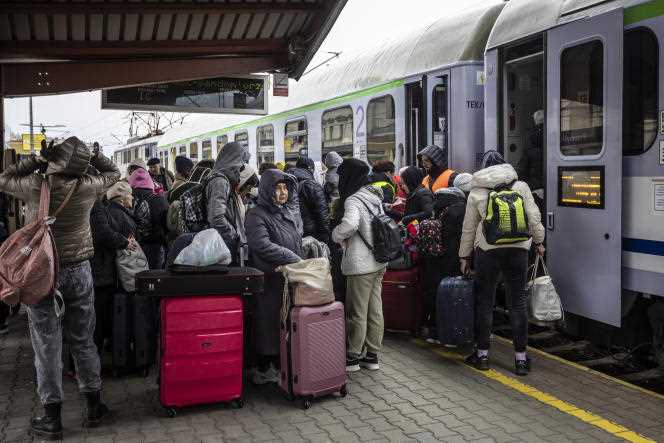 Refugees from Ukraine arrive at the boarding platform of the train to Warsaw at Przemysl station in southeastern Poland on April 5, 2022.