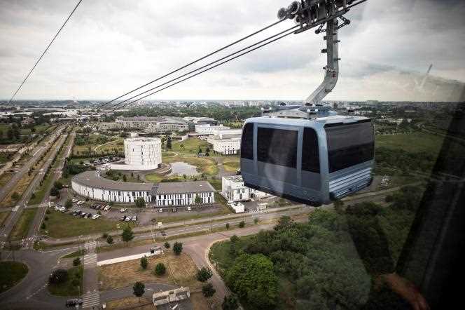 A cabin of the longest urban cable car in France, in Toulouse, with the Oncopole University Cancer Institute in the background, on May 14, 2022.