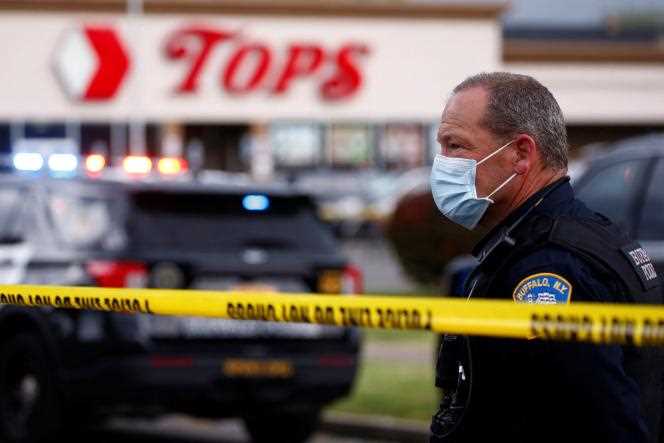 A police officer in front of the supermarket where a shooting took place on May 14, 2022 in Buffalo, New York.