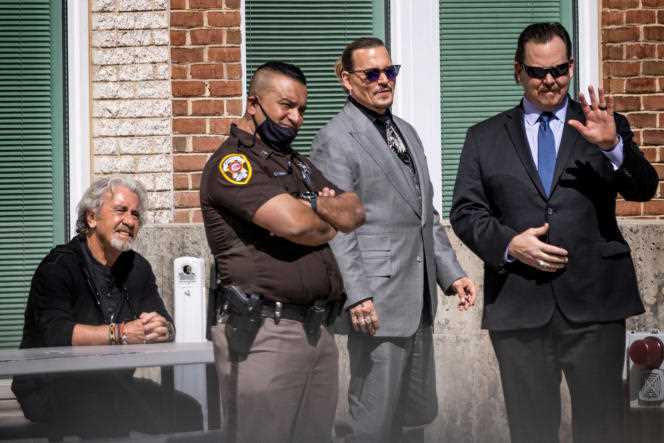 Johnny Depp (second from right) leaves court in Fairfax, Va., on April 20.
