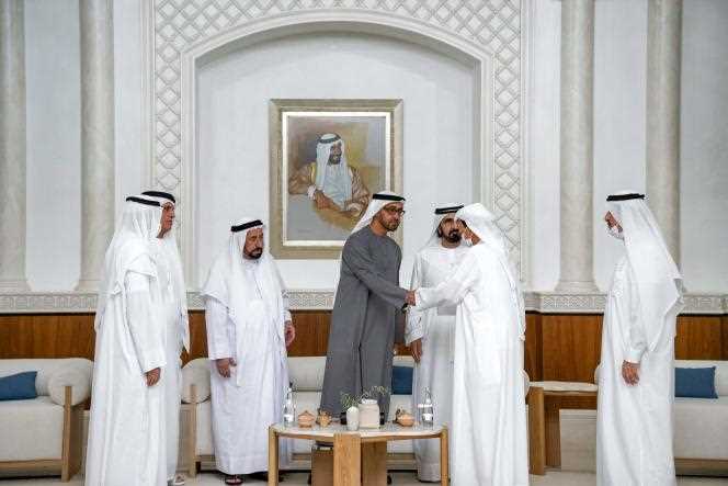 Sheikh Humaid Bin Rashid al-Nuaimi of Ajman (2nd right) shakes hands with Sheikh Mohamed Bin Zayed Al-Nahyane of Abu Dhabi (center) in Abu Dhabi, May 14, 2022.