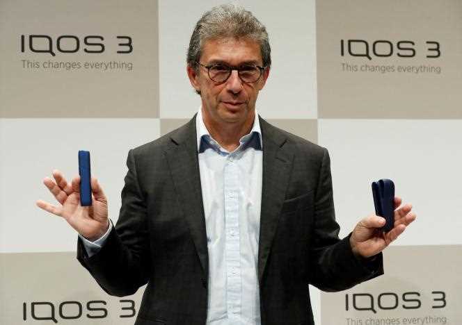 Philip Morris International CEO Andre Calantzopoulos introduces the new IQOS 3 electronic cigarette in Tokyo on October 23, 2018.  