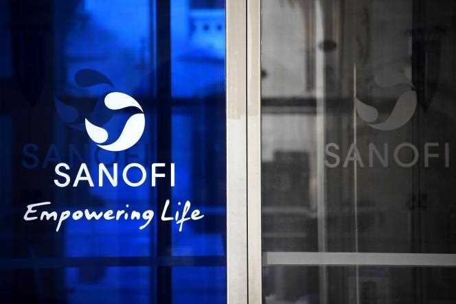 Sanofi logo at the gates of the company, in Paris, on March 27, 2020.