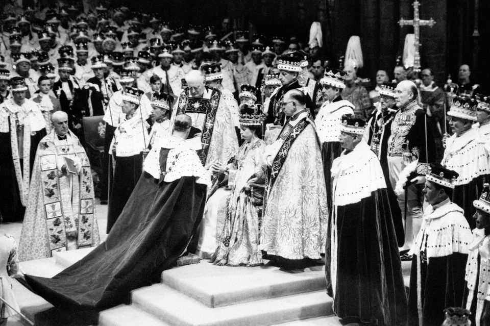 Prince Philip kneels before Queen Elizabeth and swears his allegiance to her