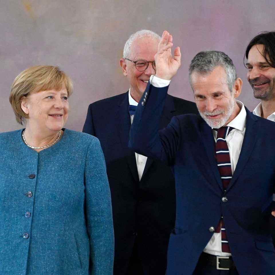 Angela Merkel was also present when Ulrich Matthes (front) was honored.