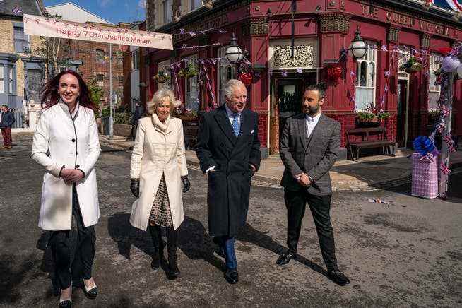 Prince Charles and the Duchess of Cornwall on set with producers Kate Oates and Chris Clenshaw.