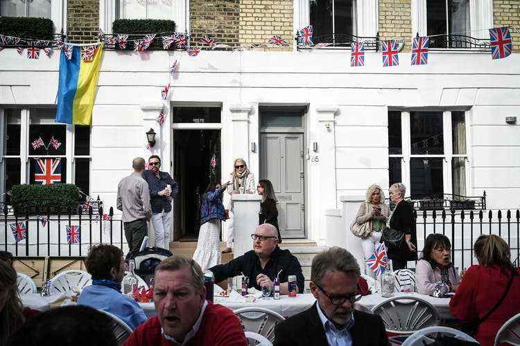 Long garden tables on the open road and British flags characterize the street parties for the Queen's jubilee.