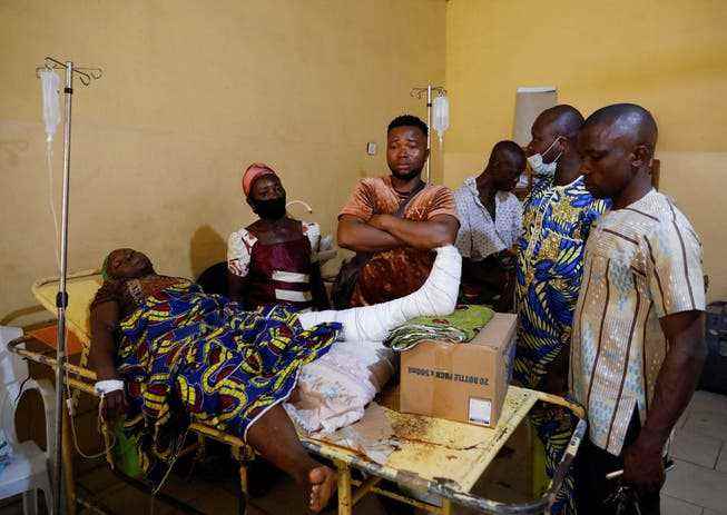 Relatives have gathered at a hospital around an injured victim of the attack on the church in Owo.