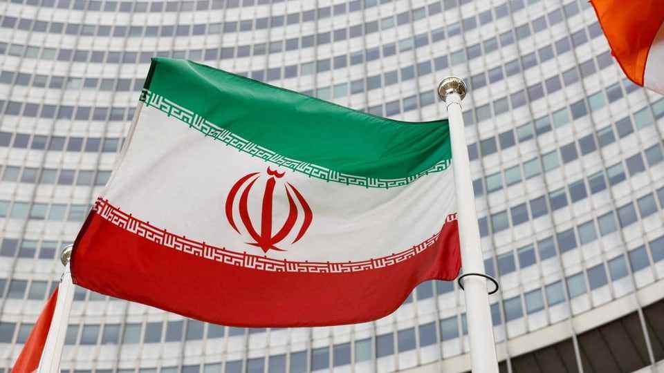 Iranian flag in front of the International Atomic Energy Agency headquarters.