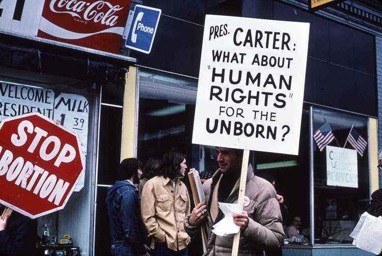 Opponents of abortion rights demonstrate in Clinton, Massachusetts, in March 1977 during a visit by President Jimmy Carter.