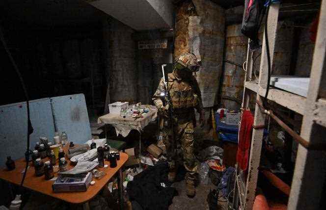 During a press release, a Russian soldier inspects an underground shelter at the Azovstal steelworks in Mariupol on June 13, 2022. 