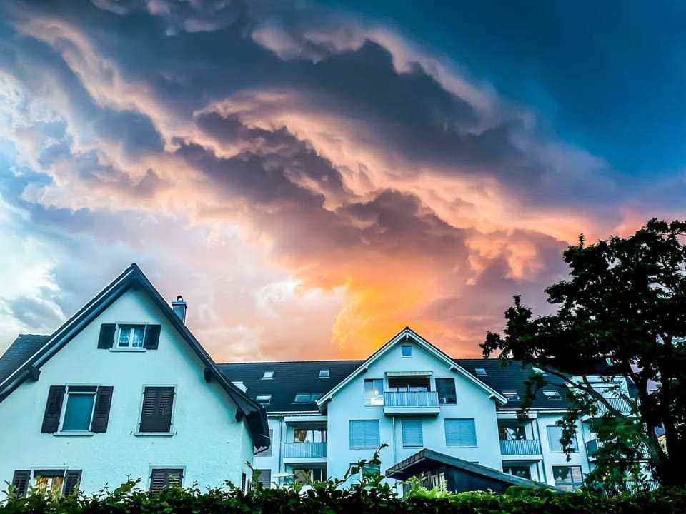 Storm clouds over residential houses.