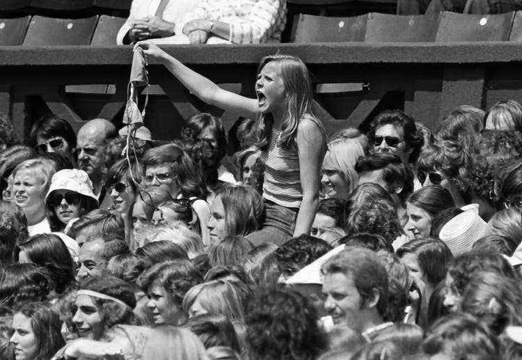 A female Björn Borg fan performs at a rock concert on posh Center Court in 1975.