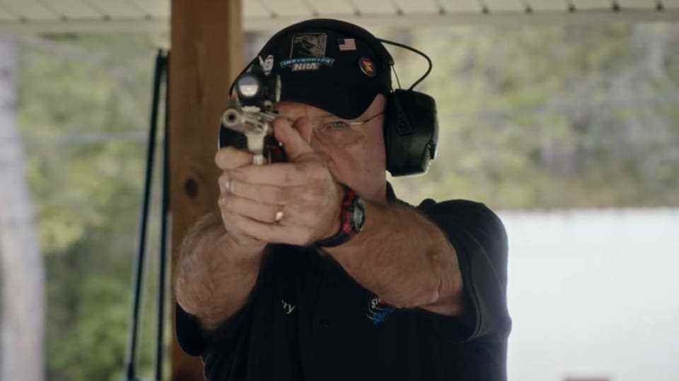 Terry Marksberry with pistol at target practice