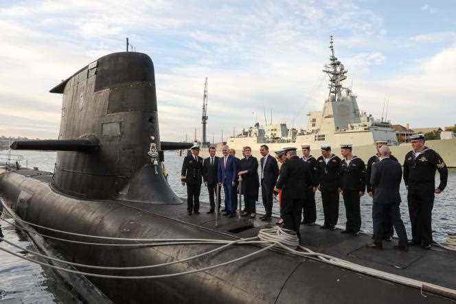 Emmanuel Macron and former Australian Prime Minister Malcolm Turnbull on the deck of HMAS Waller, a Collins-class submarine, in Sydney, May 2, 2018.