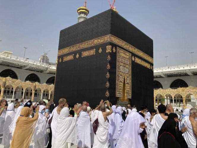Pilgrims walk around the Kaaba, a holy shrine at the center of the Grand Mosque in Mecca, Saudi Arabia, March 6, 2022.