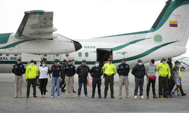 Police present to the media five people accused of the murder of Paraguayan prosecutor Marcelo Pecci, on the tarmac of the airport in Bogota, Colombia, June 8, 2022.