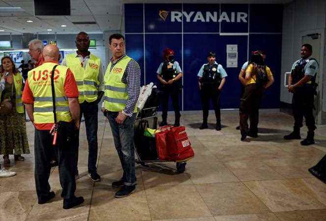 Security guards at Adolfo Suarez Madrid-Barajas airport as Ryanair workers gather for a strike, June 24, 2022, in Madrid.