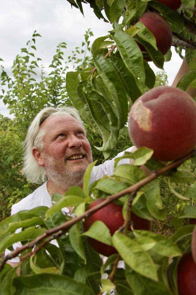 Michel Vicq, proud of his orchard.