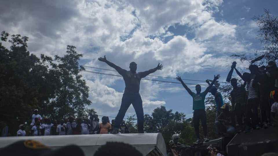 Demonstrators are demanding that ex-President Bertrand Aristide be restored to power in Haiti.