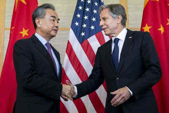 Chinese Foreign Minister Wang Yi and US Secretary of State Antony Blinken shake hands during their meeting in the resort town of Nusa Dua on the island of Bali, Indonesia on 9 July 2022.