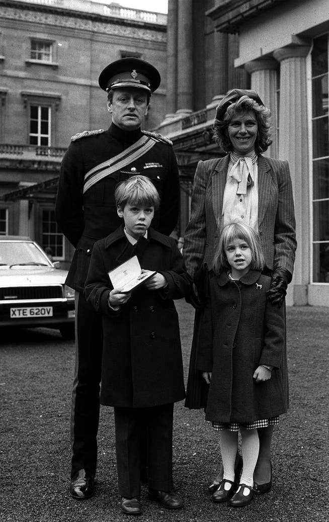 British officer Andrew Parker-Bowles with Camilla and children Tom and Laure in front of Buckingham Palace in February 1984. Parker-Bowles received a medal from the Queen that day.