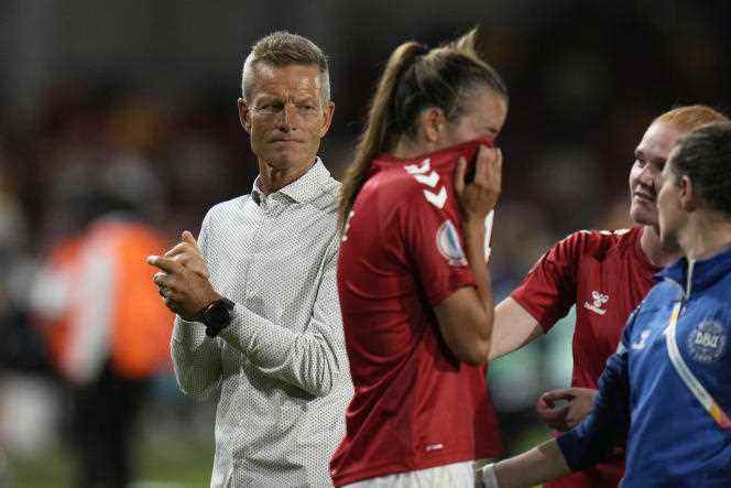 The tears of Danish defender Rikke Sevecke under the eyes of her coach Lars Sondergaard (left) at the end of the match lost by the Scandinavian selection against Germany (4-0) Friday July 8 at Brentford Community Stadium, in London. 