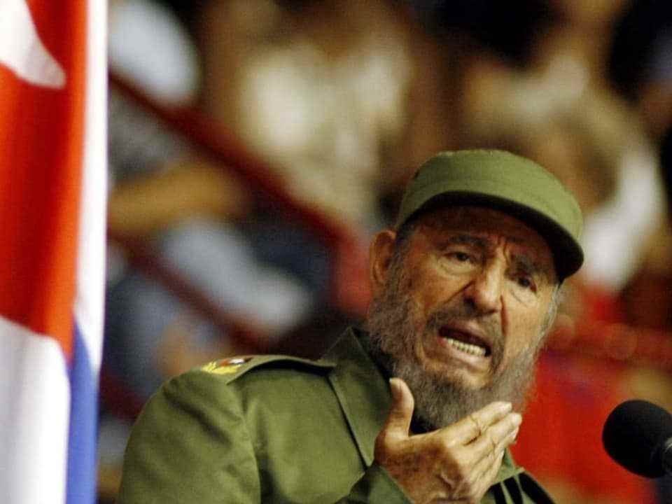 Castro in green military uniform and cap