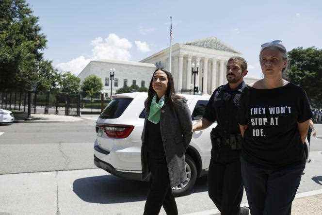 Alexandria Ocasio-Cortez escorted by Capitol Police after a demonstration outside the Supreme Court to protest recent abortion-related rulings.  In Washington, July 19, 2022.