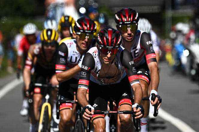 New Zealander George Bennett leads the peloton with his UAE Emirates teammates on the road to the 10th stage of the Tour de France, between Aigle and Châtel, on July 10, 2022.
