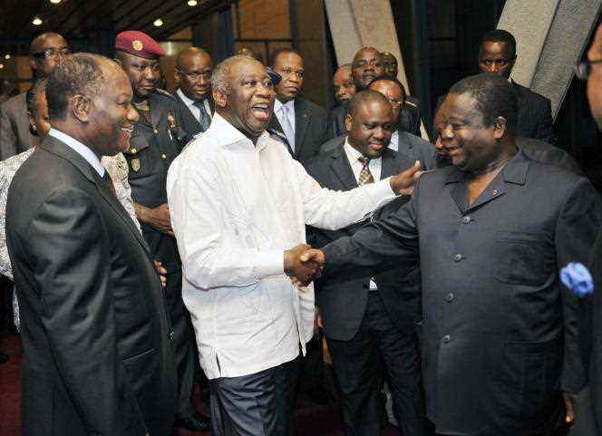 From left to right: Alassane Ouattara, Laurent Gbagbo and Henri Konan Bédidé, in Abidjan, June 30, 2010.