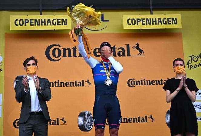 Belgian Yves Lampaert dons the yellow jersey after his victory in the time trial in Copenhagen, the first stage of the Tour de France 2022, on July 1.