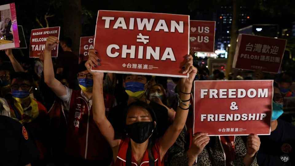 Taiwan woman holds up sign with 