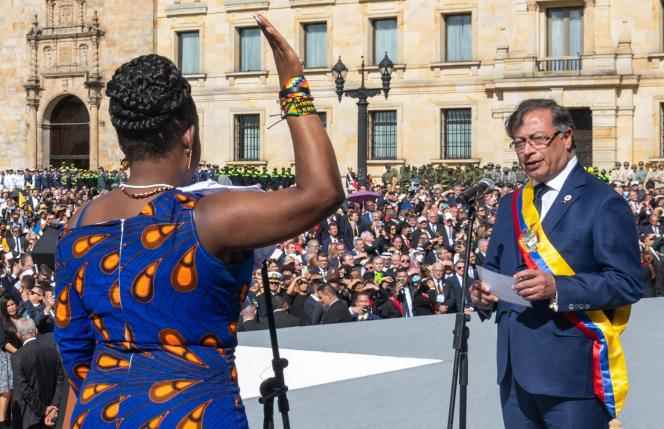 This photo released by the Presidential Press Office shows Colombia's new head of state Gustavo Petro swearing in Vice President Francia Marquez during their inauguration ceremony in Bolivar Square in Bogota on August 7, 2022.