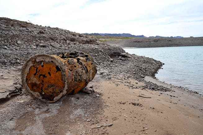 A rusty barrel on the shore of Lake Mead