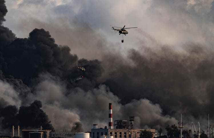 A fire brigade helicopter throws water at the large fire north of the Cuban capital on August 8th.