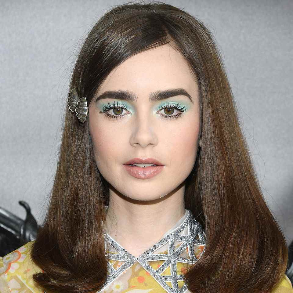 Blue Eyeshadow: Lily Collins at the Miu Miu 2019 Cruise Show with pastel blue eyeshadow