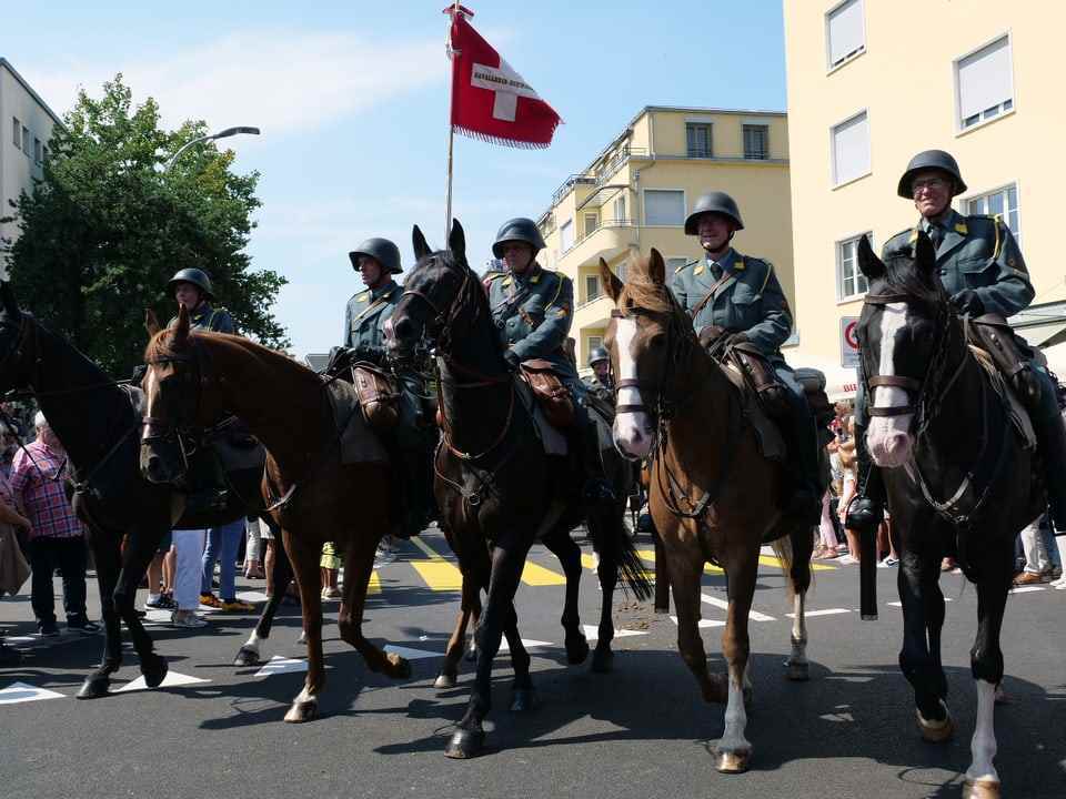 Men in uniform on horses